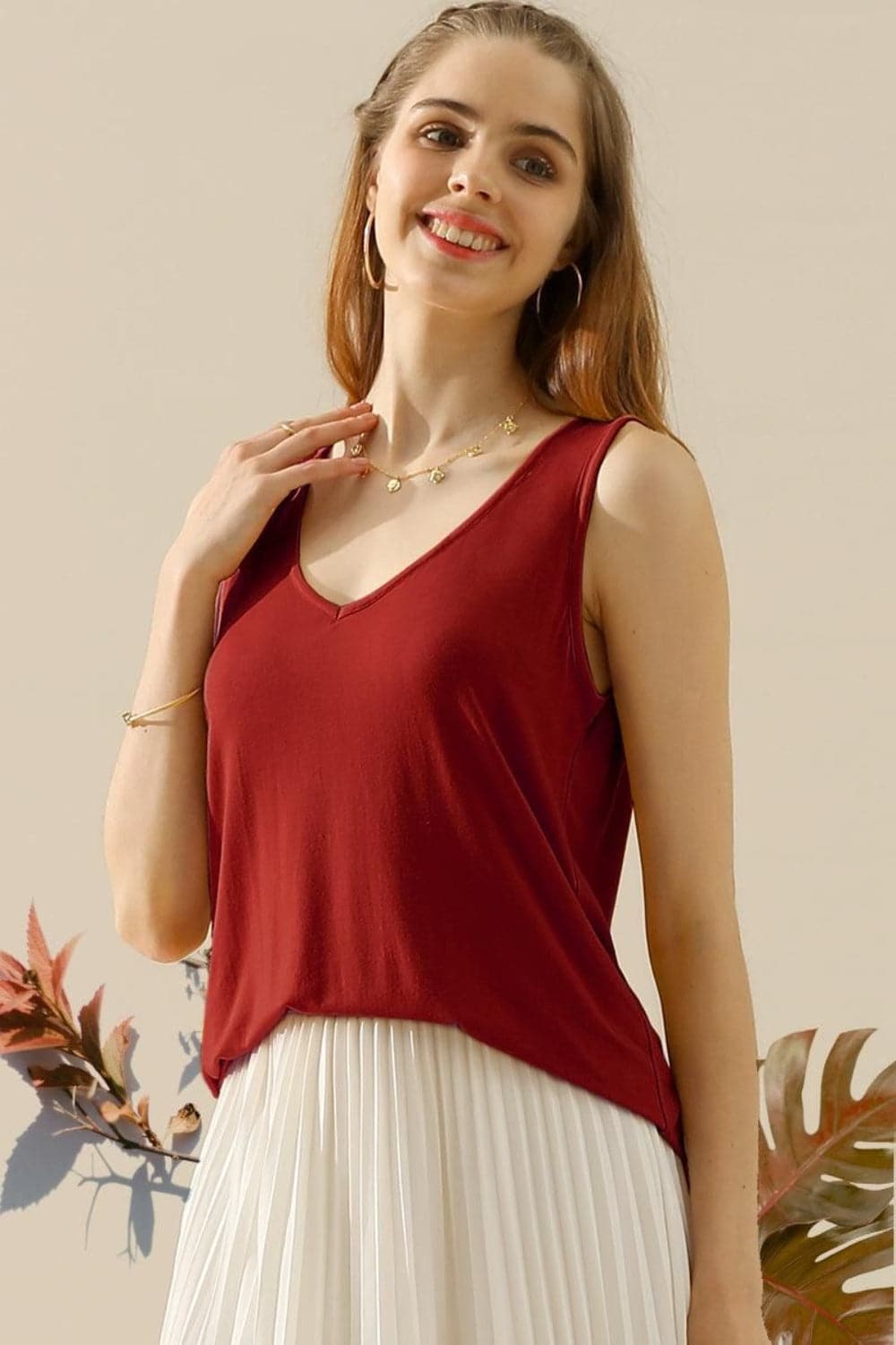 Ninexis Full Size V-Neck Curved Hem Tank.