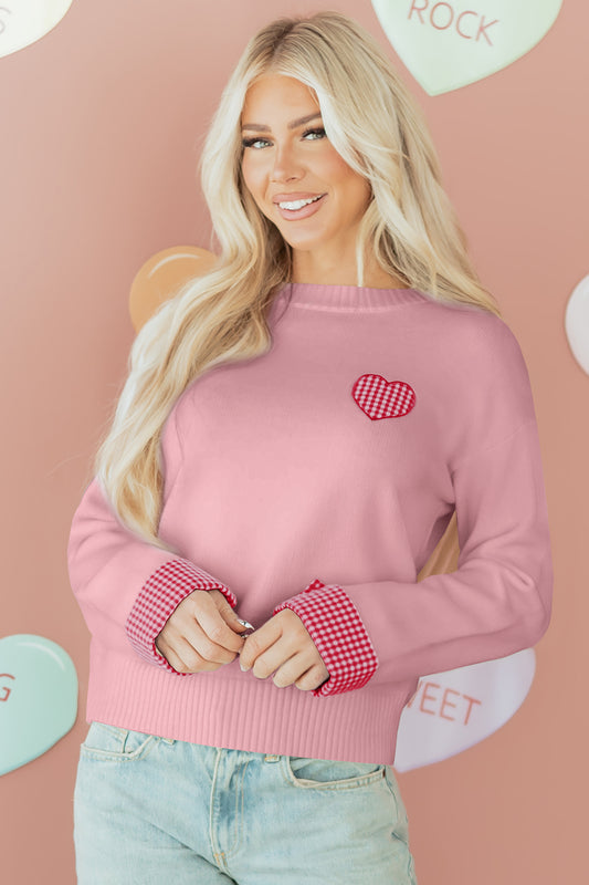 Full view of the Dear-Lover Light Pink Plaid Heart Embroidered Crew Neck Sweater, showcasing its drop shoulder and cuffed sleeves.