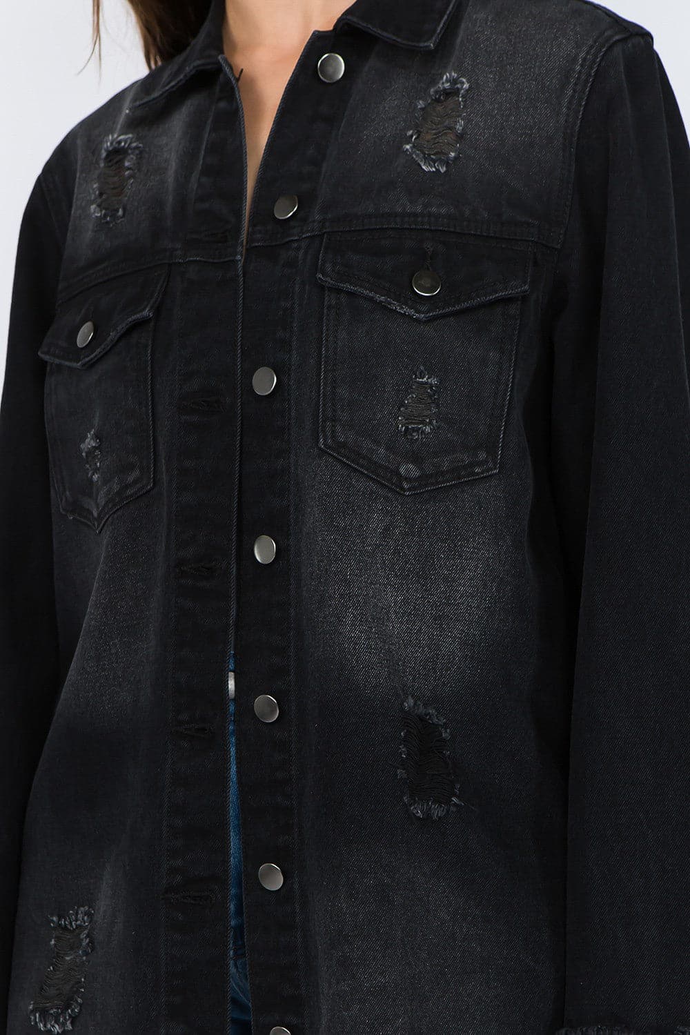 Vintage-inspired distressed denim jacket with frayed hem