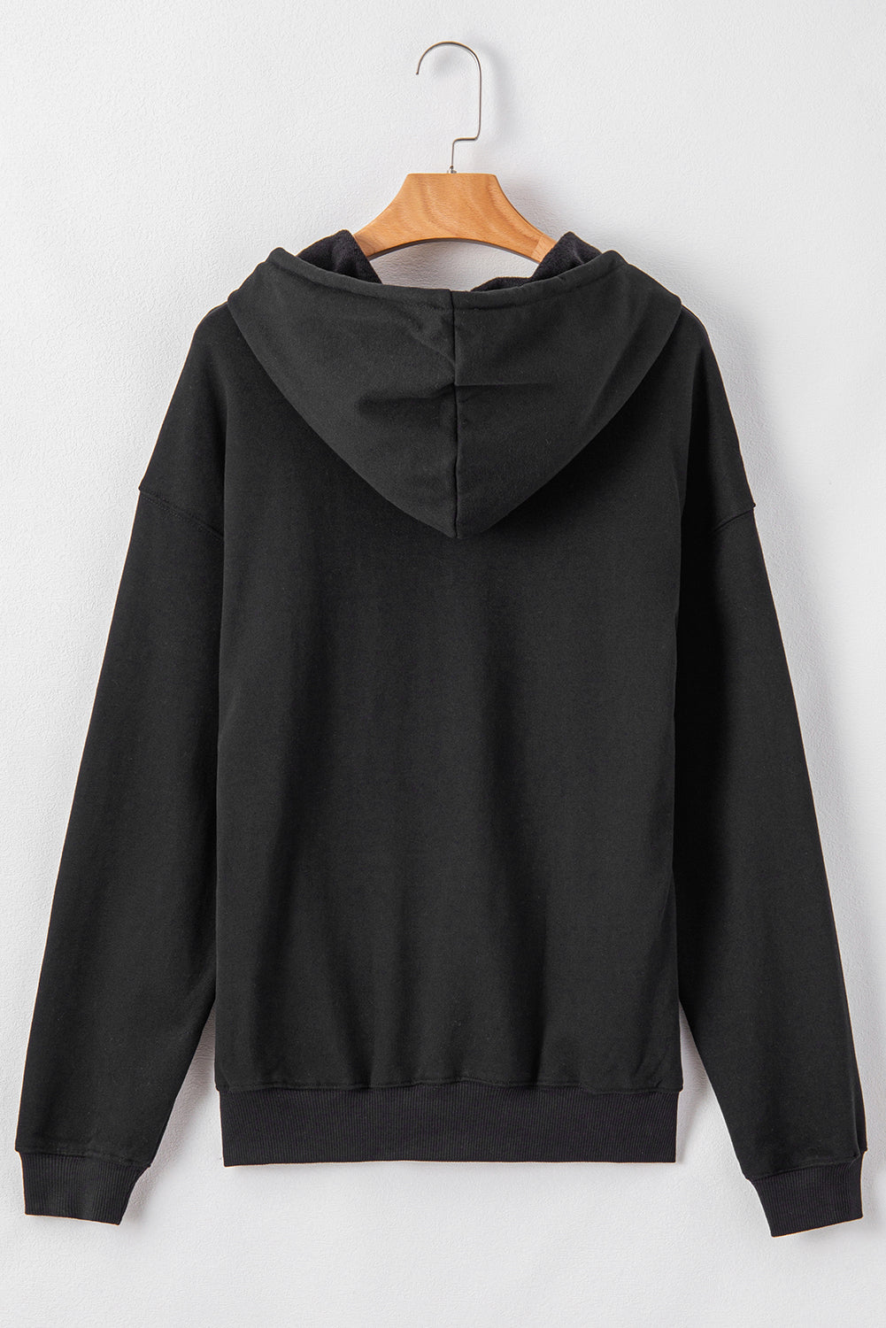 Cozy black fleece-lined hoodie with kangaroo pocket and drawstring design