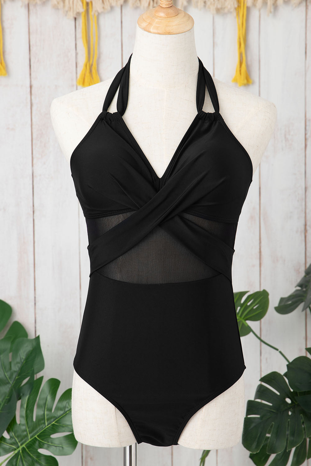 Elegant black halter one-piece swimsuit with mesh inserts