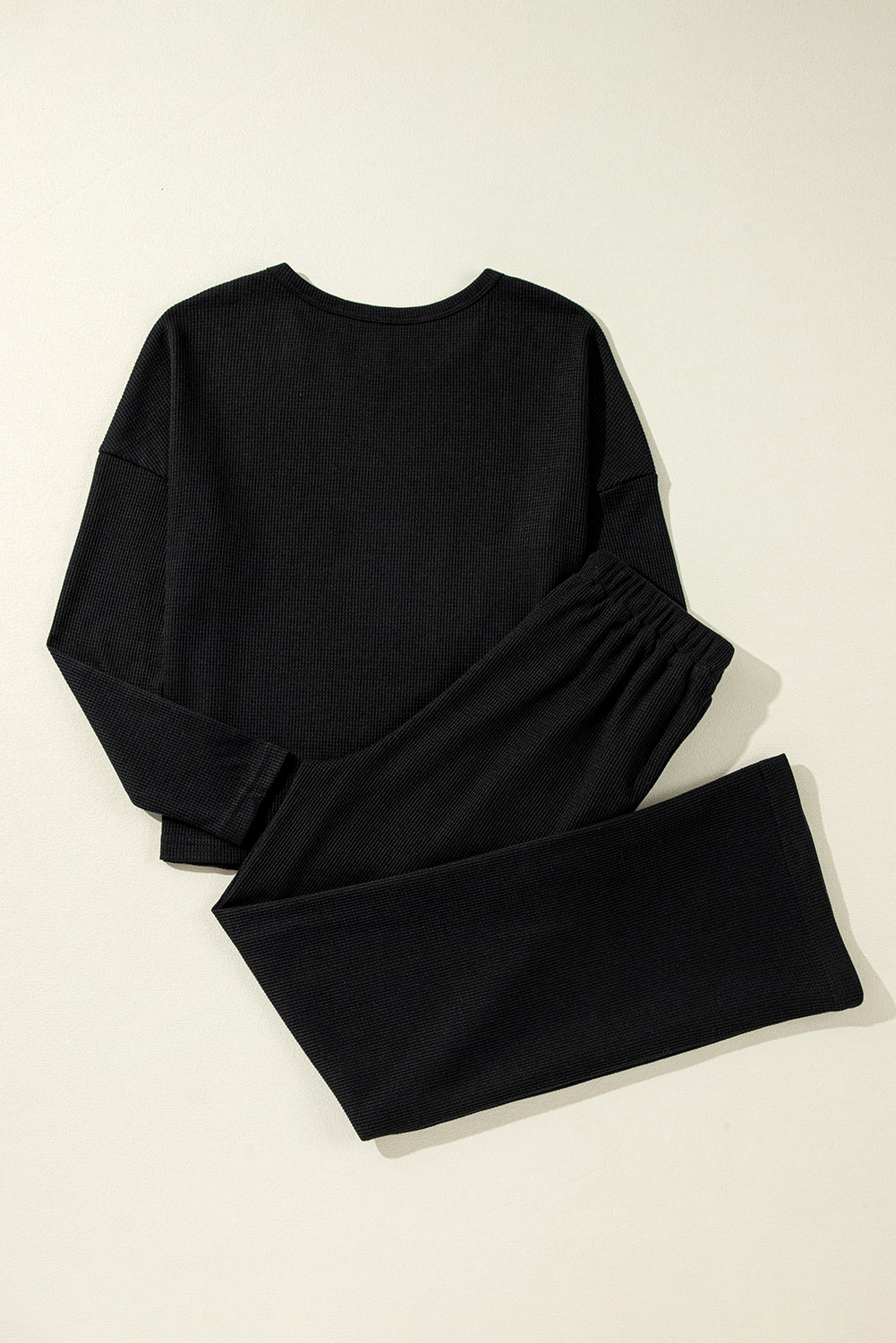 Cozy black textured lounge set with long sleeves and drawstring pants