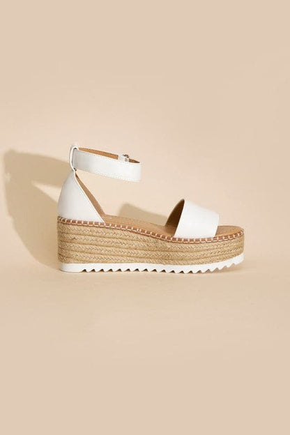 TUCKIN-S PLATFORM SANDALS.