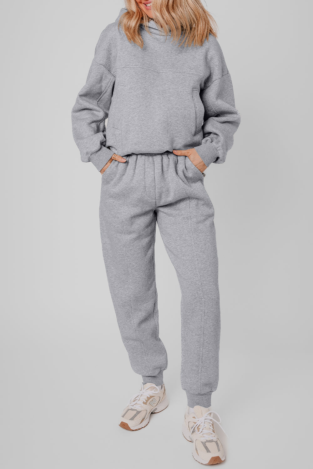 Stylish gray hoodie and joggers set with exposed seams