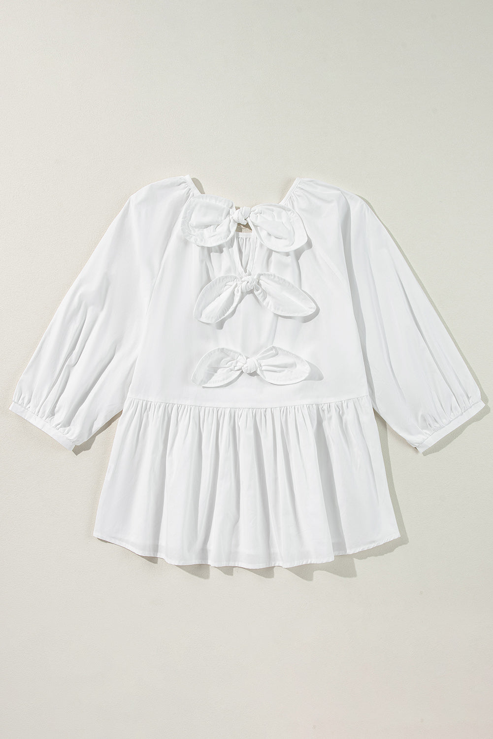 Chic white blouse with bow knot and cutout back design