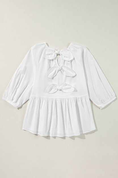 Chic white blouse with bow knot and cutout back design