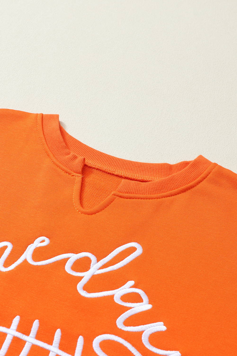 Cheer on game day with our stylish orange rugby sweatshirt