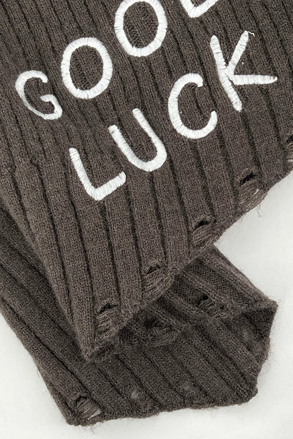 GOOD LUCK Distressed Off-Shoulder Sweater.