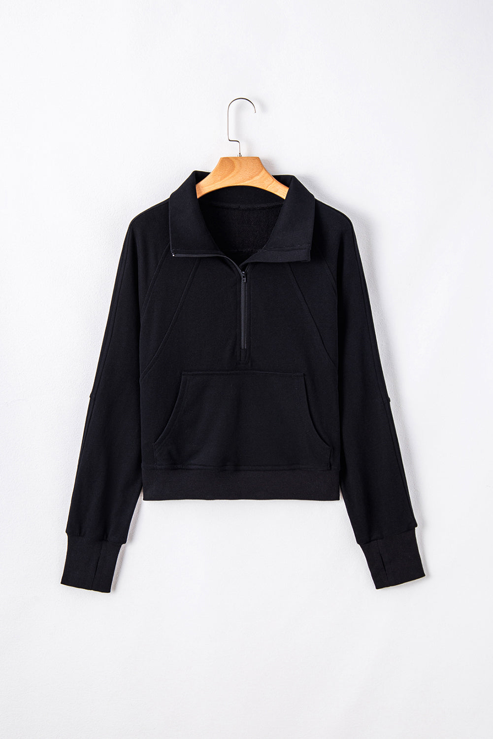 Chic black quarter zip sweatshirt with kangaroo pocket