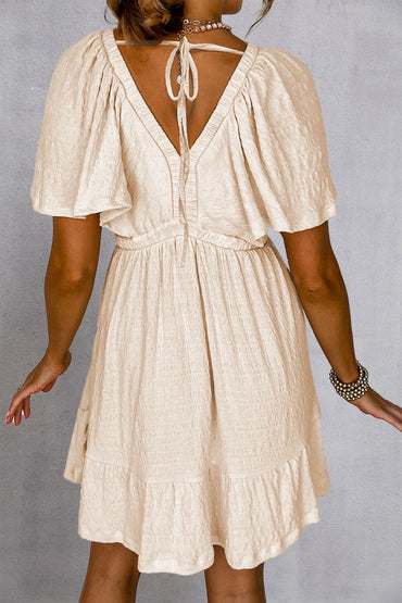 Tied V-Neck Short Sleeve Mini DressTied V-Neck Short Sleeve Mini Dress
 Indulge in Effortless Elegance with Our Tied V-Neck Short Sleeve Mini Dress. Elevate your style effortlessly with this versatileLove Salve -Neck Short Sleeve Mini Dressswimwear