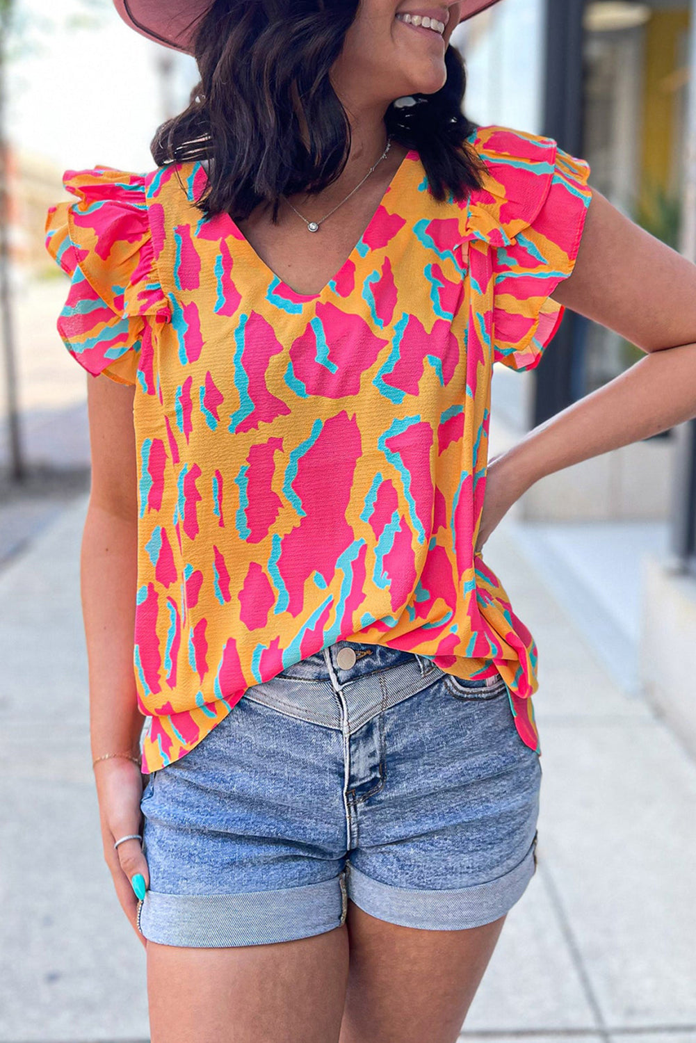 Vibrant orange abstract ruffled sleeve blouse with V neck