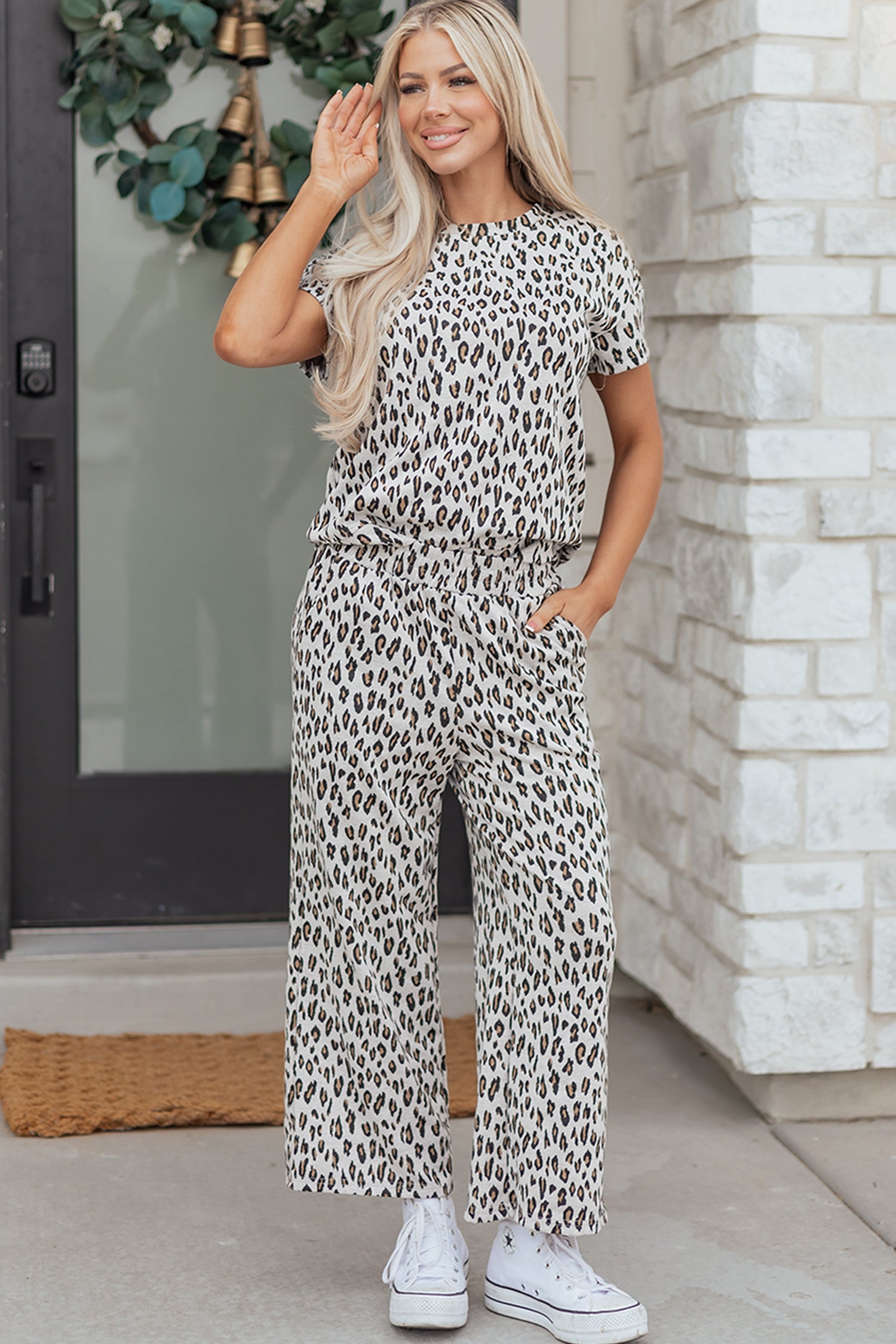Model wearing the Dear-Lover Beige Leopard Print 2pc tee and pants set, perfect for a comfortable summer casual daily outfit.