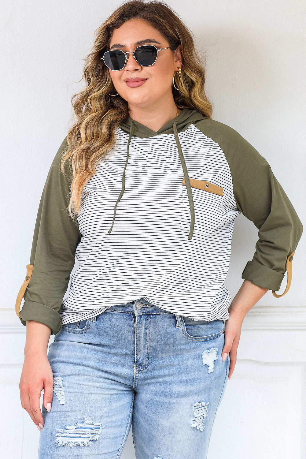 Green striped plus size hoodie with raglan sleeves and buttoned pocket