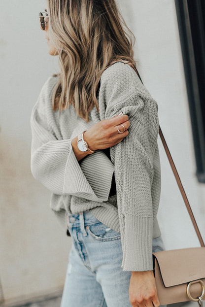 Chic textured long sleeve sweater with stylish slit detail