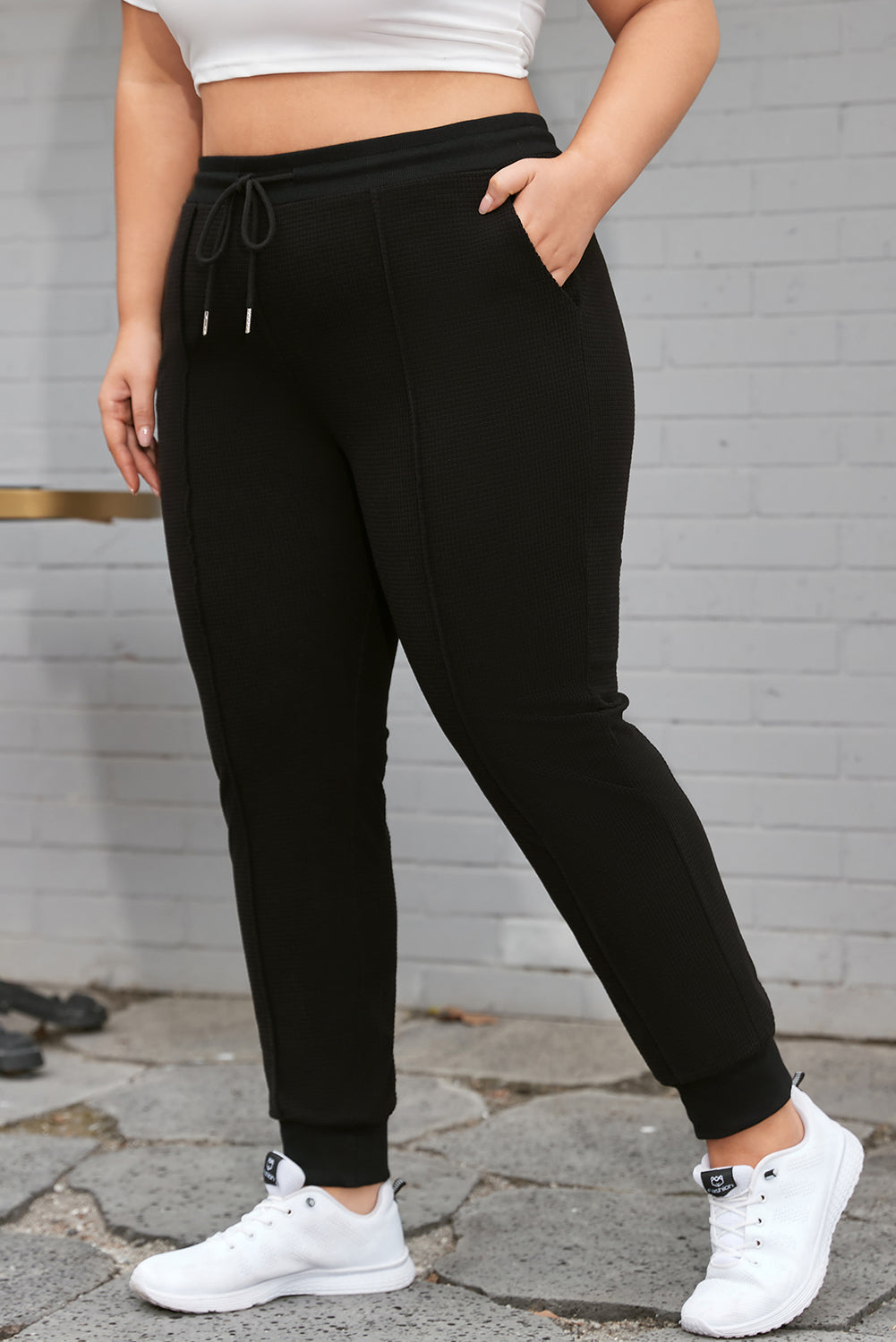 Trendy black plus size joggers with drawstring and textured design