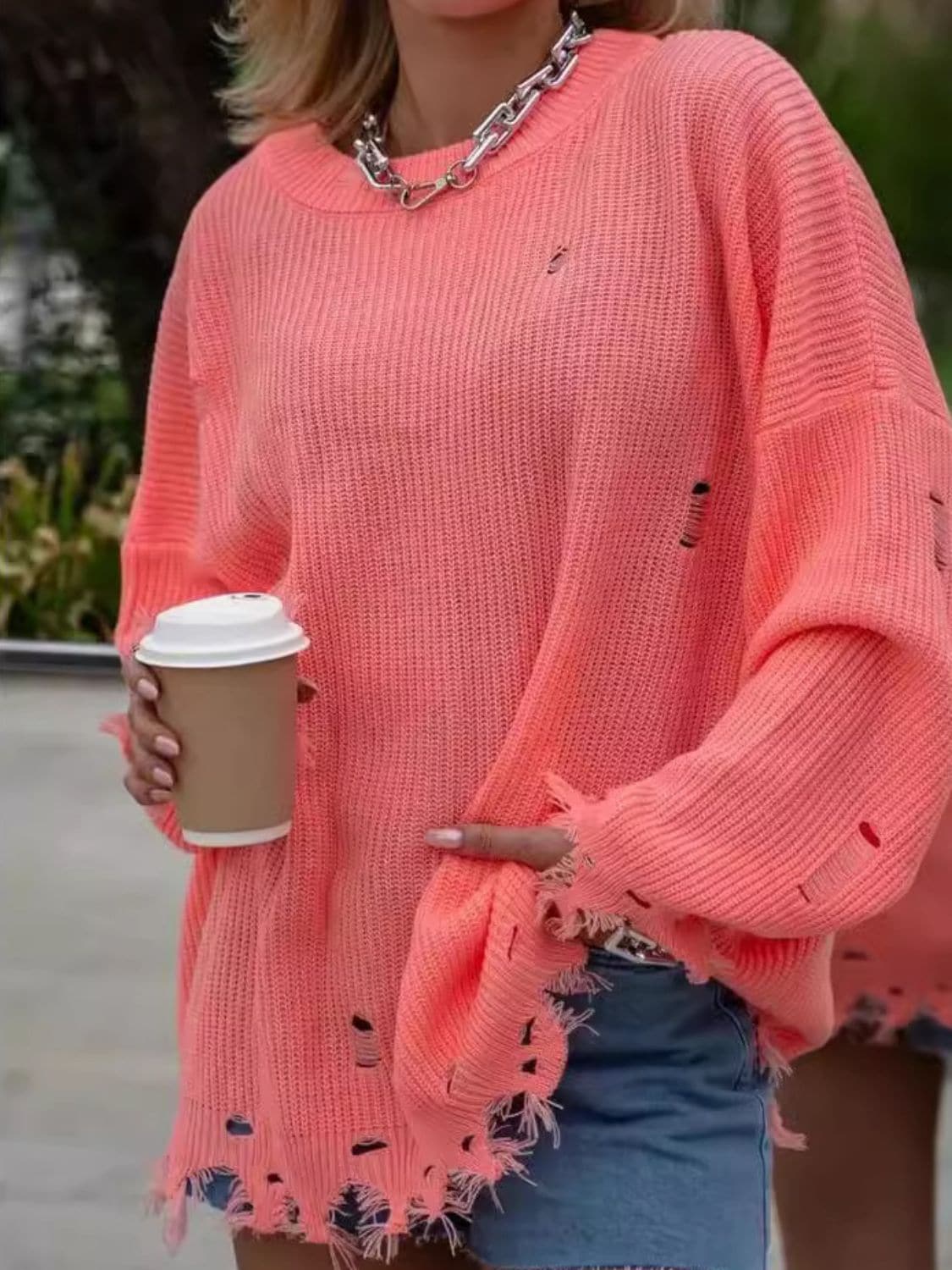 Chic distressed long sleeve sweater with a cozy round neck