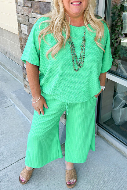 Chic mint green plus size batwing sleeve tee and wide-leg pants ensemble