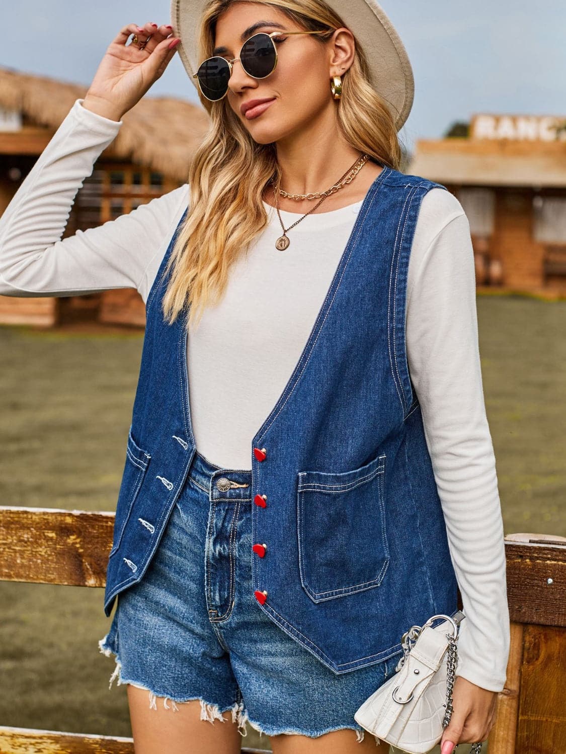 Pocketed Button Up Sleeveless Denim Jacket.