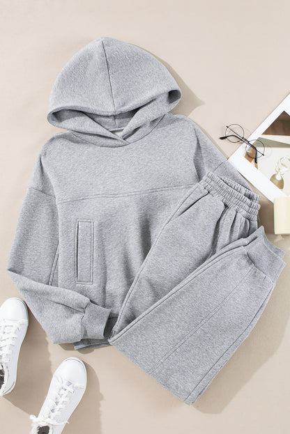 Stylish gray hoodie and joggers set with exposed seams