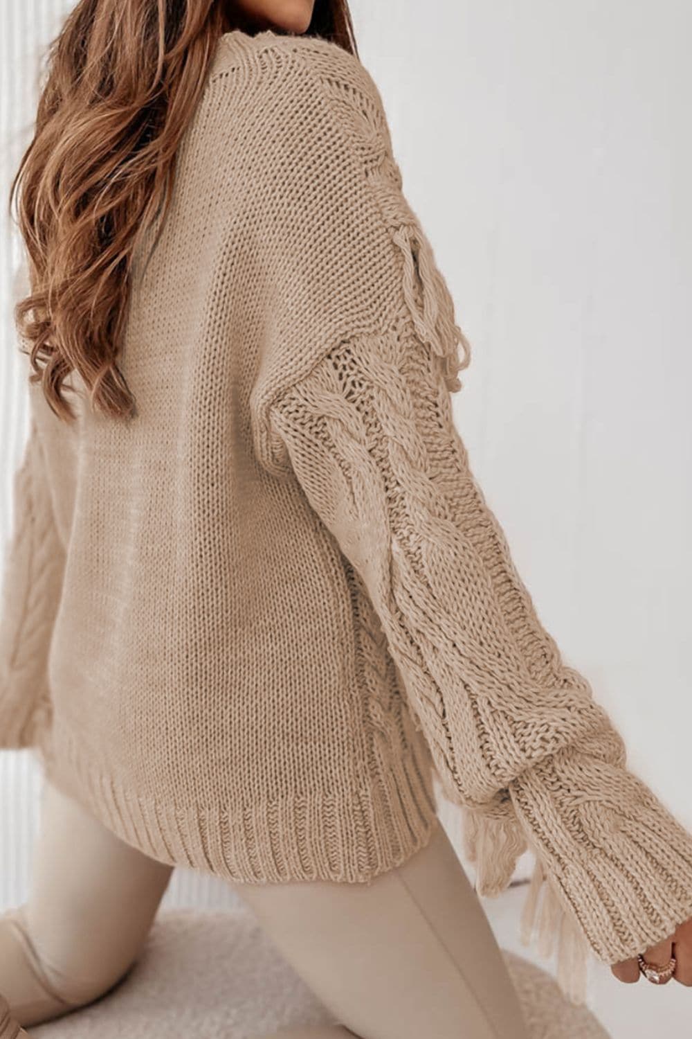 Cable-Knit Fringe Round Neck Sweater.