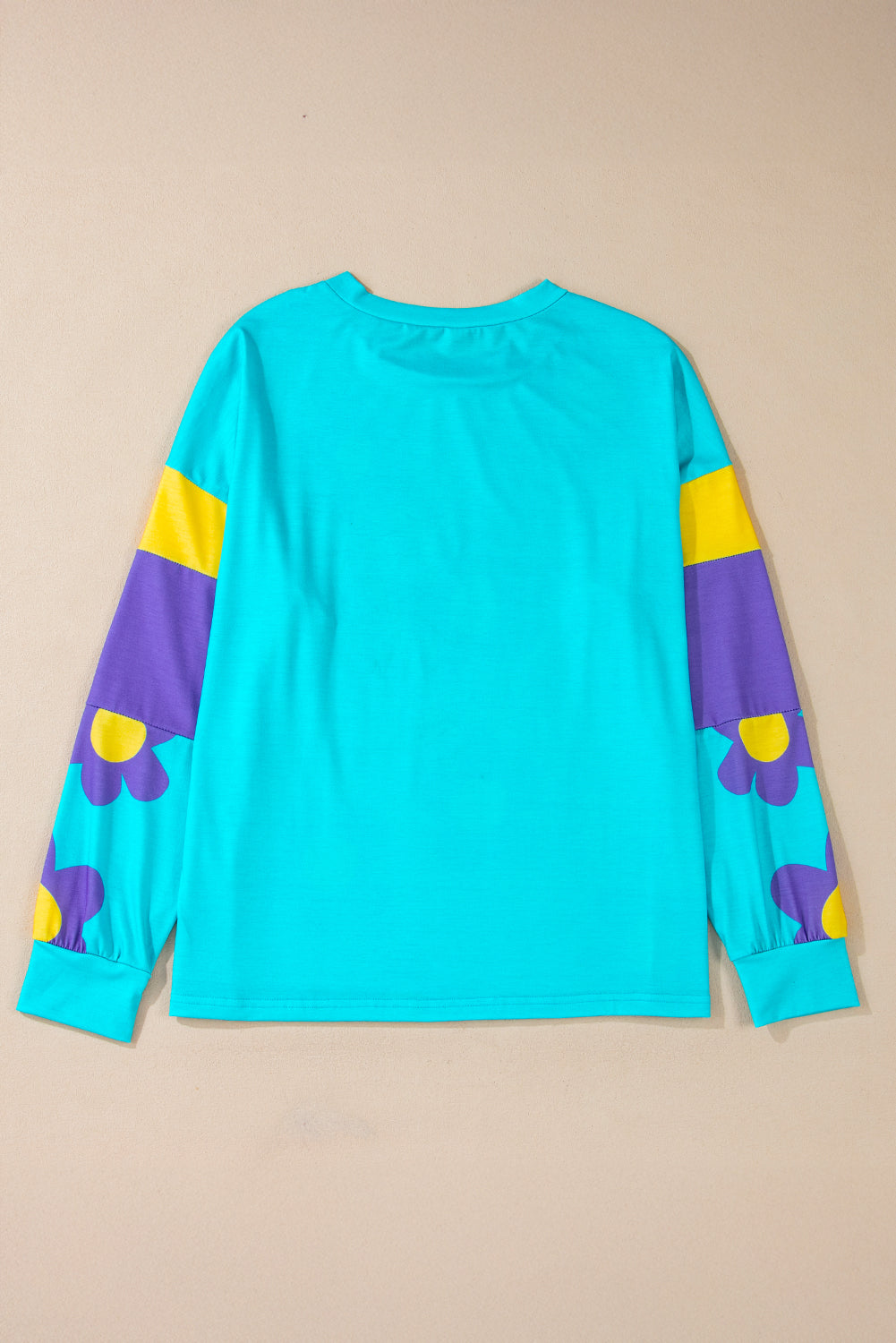 Charming sky blue floral color block long sleeve top