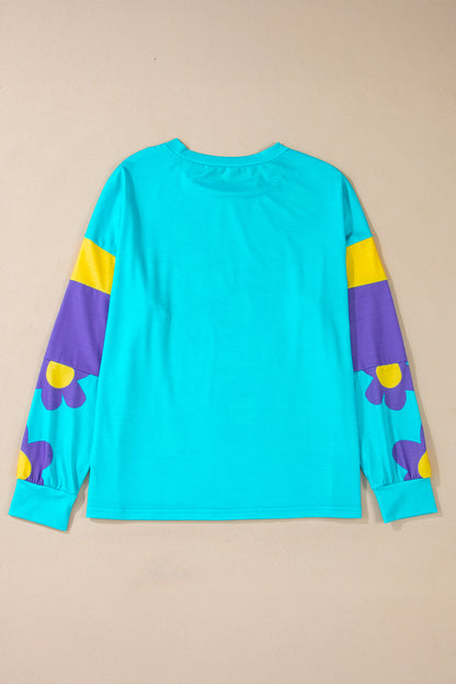 Charming sky blue floral color block long sleeve top