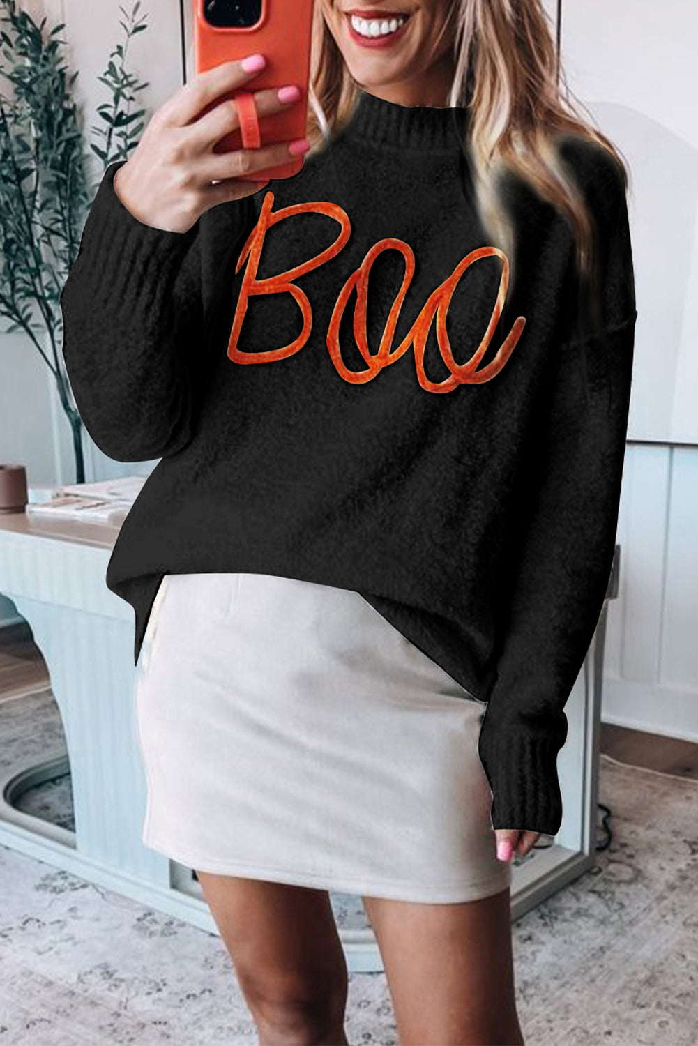 Cozy black "Boo" knitted sweater with ribbed edges for casual style