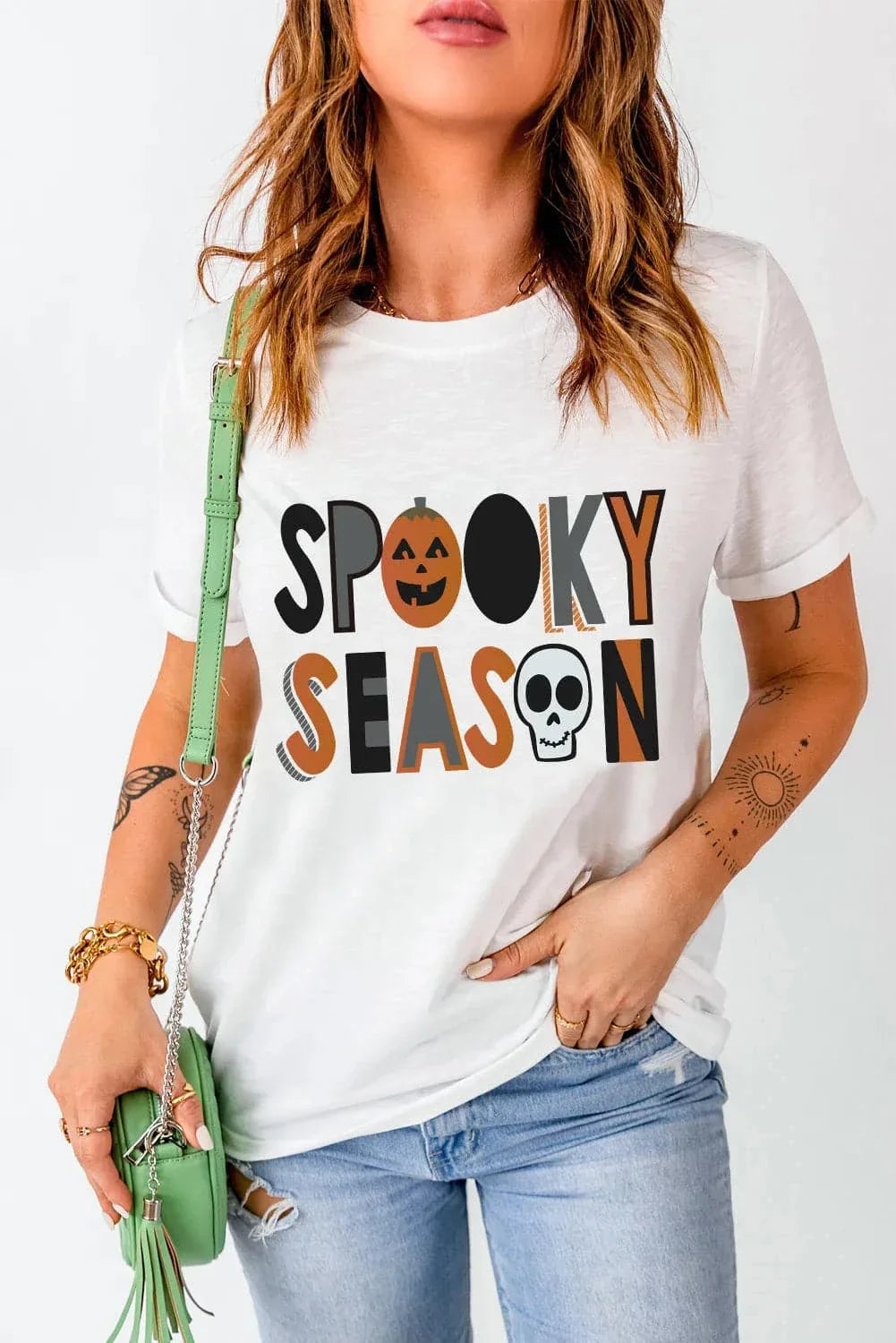 Letter graphic round neck short sleeve tee with "Spooky Season" print, available in sizes S to XL.