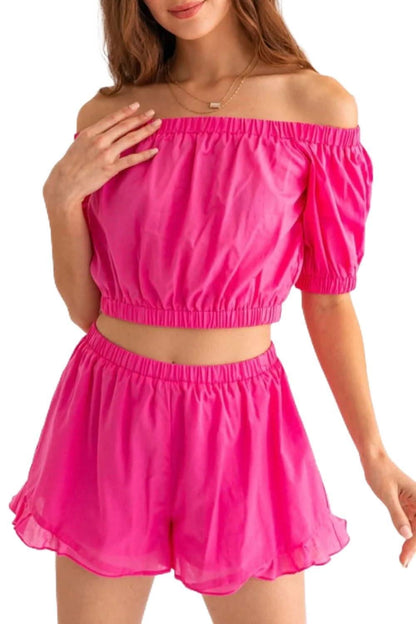 Chic off-shoulder crop top and playful ruffled shorts set