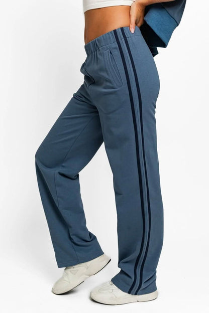 Chic high-waisted track sweatpants with stylish side stripes