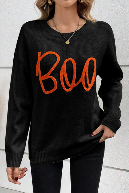 Cozy black "Boo" knitted sweater with ribbed edges for casual style