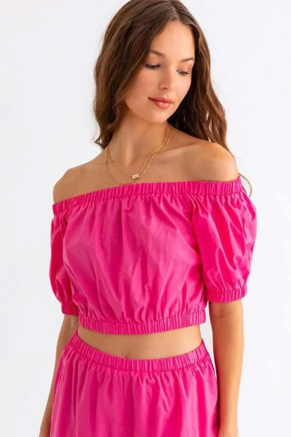 Chic off-shoulder crop top and playful ruffled shorts set