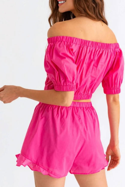 Chic off-shoulder crop top and playful ruffled shorts set