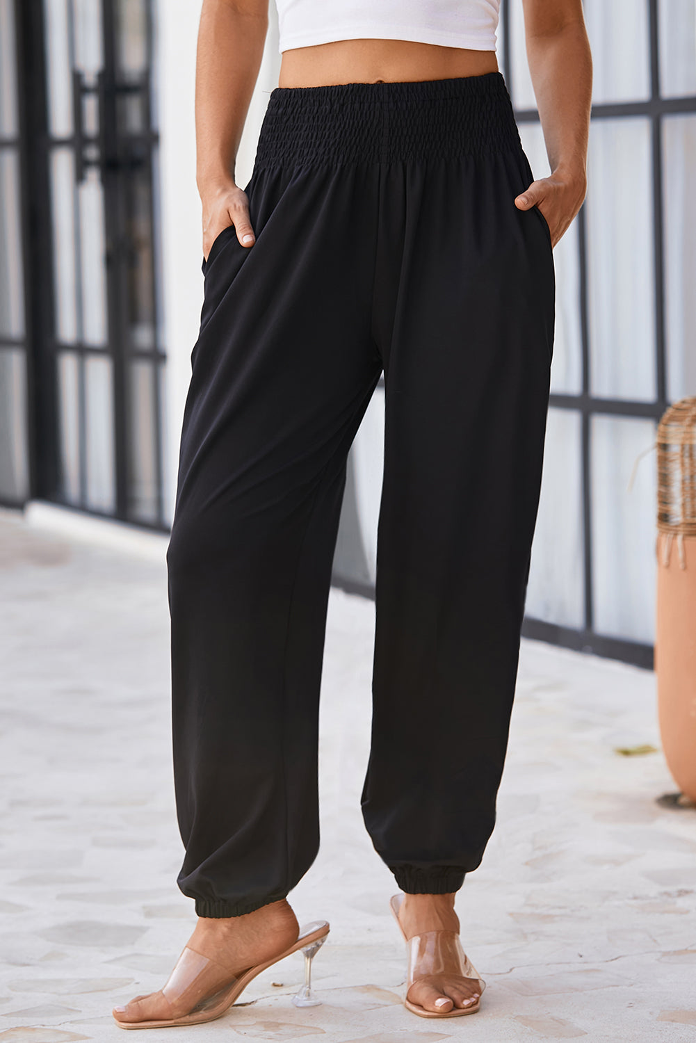 Chic black smocked high-rise joggers for a trendy look