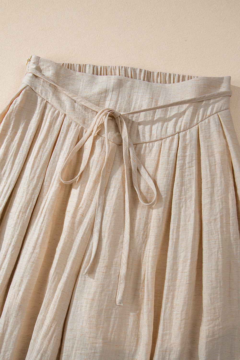 Beige high-waisted wide-leg trousers