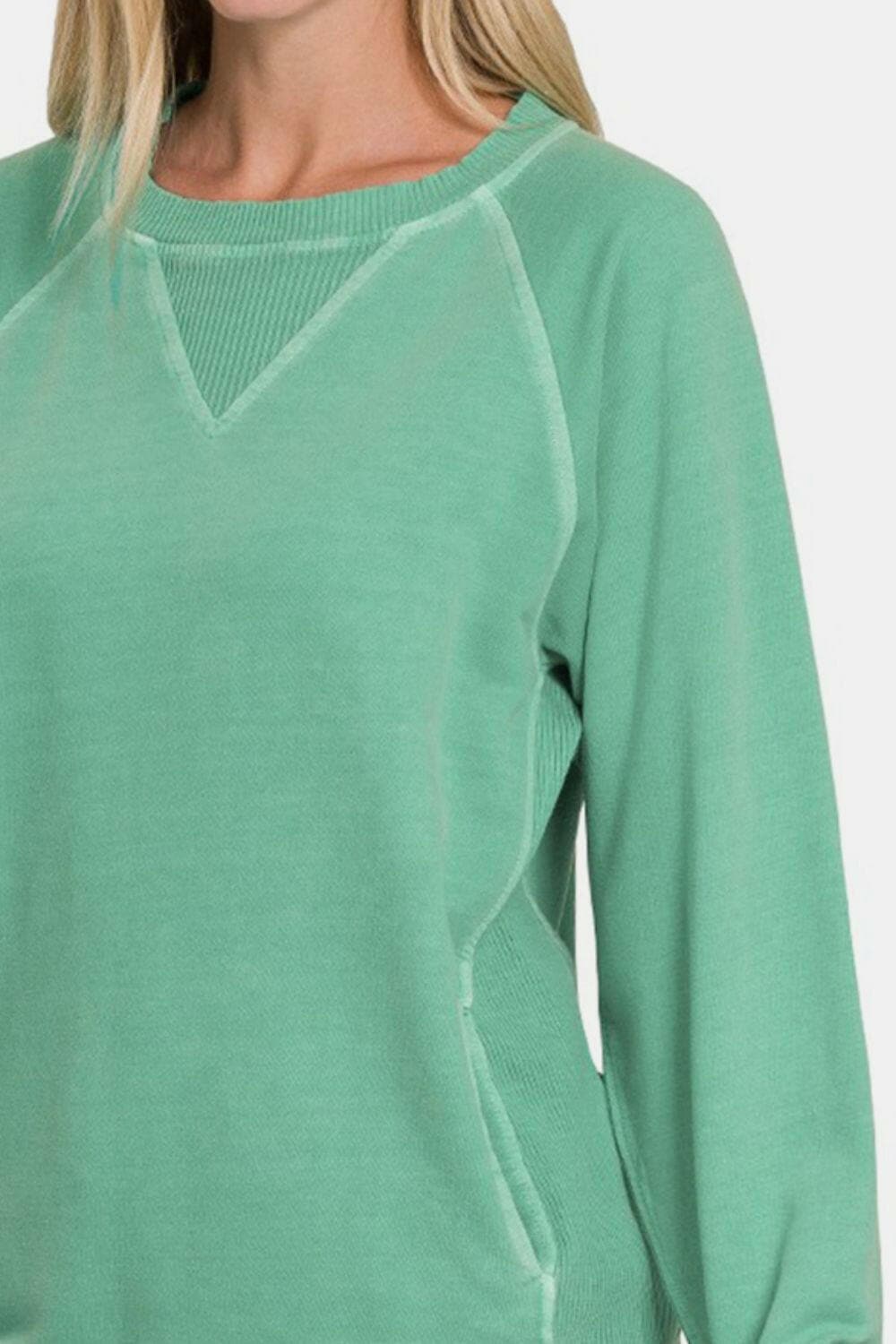 Zenana Pocketed Round Neck Long Sleeve Sweatshirt.