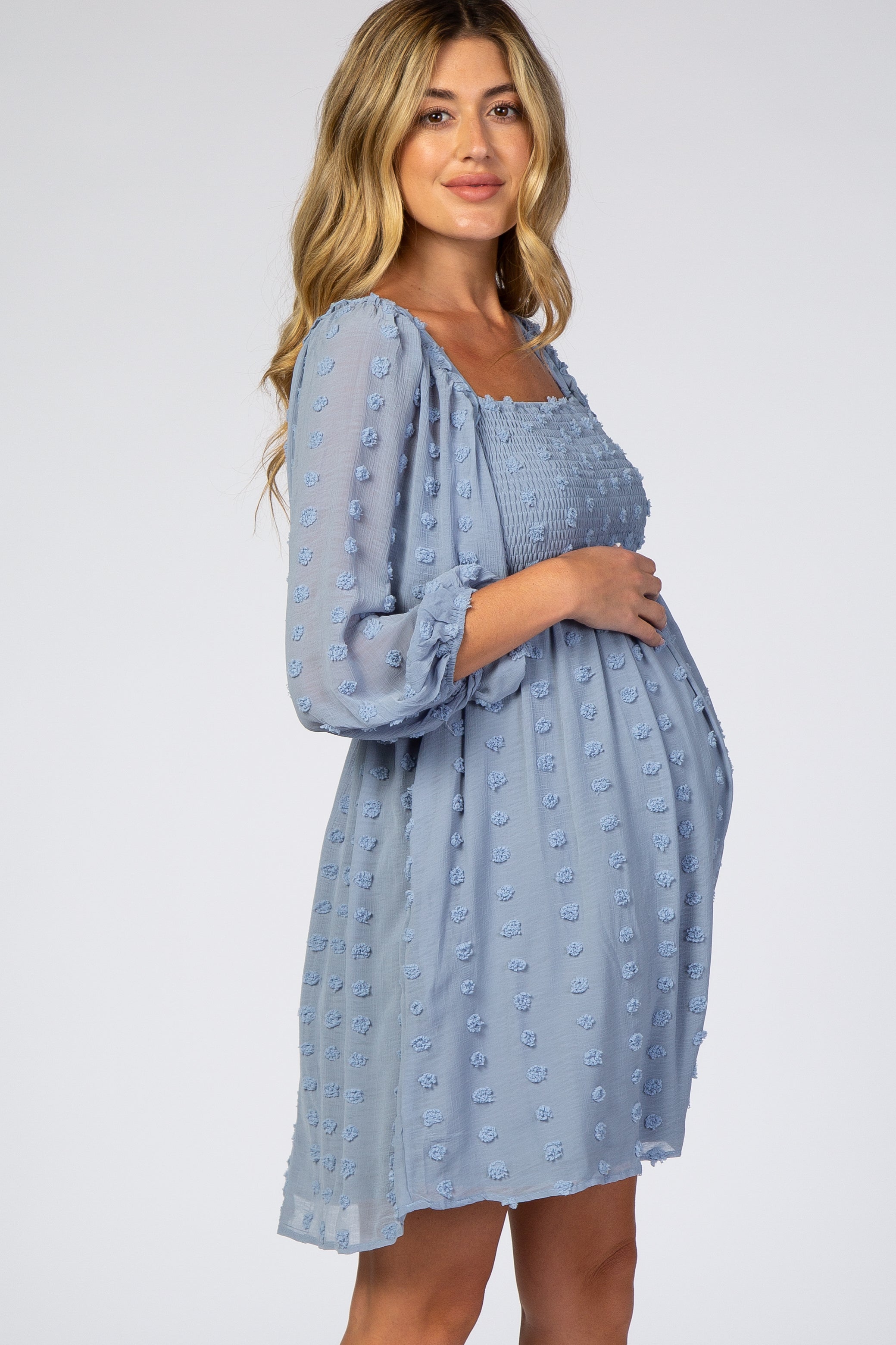 Light blue chiffon maternity dress full length side view with flowing silhouette