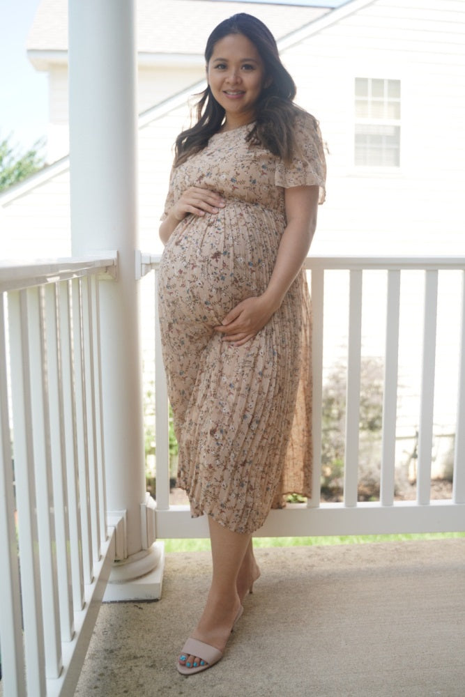 Pregnant woman wearing PinkBlush beige floral maternity midi dress lifestyle