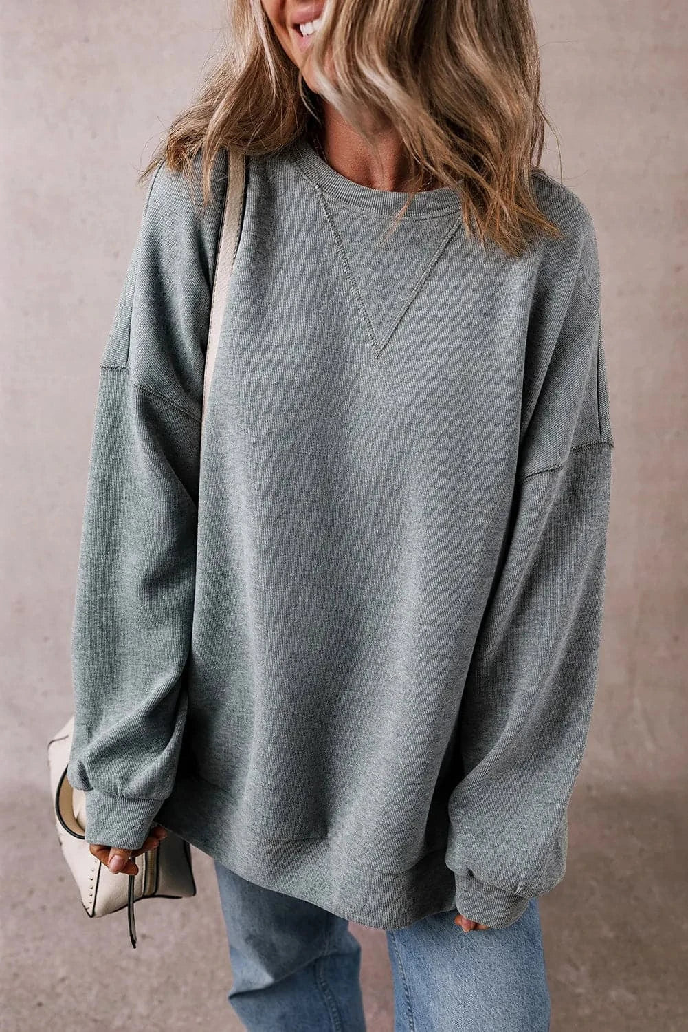 Slit Round Neck Long Sleeve Sweatshirt.