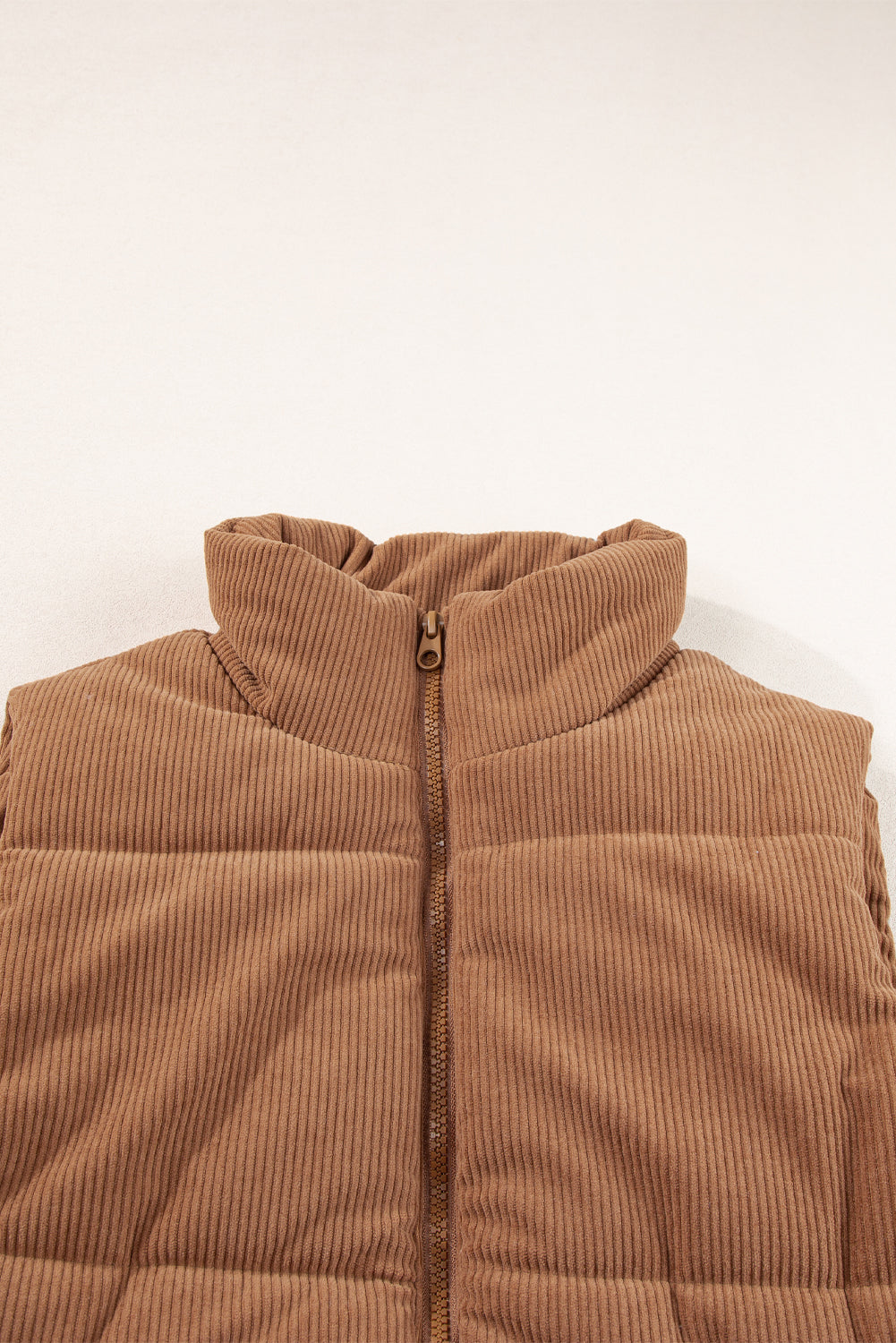 Cozy coffee corduroy puffer vest with stand neck and zipper closure