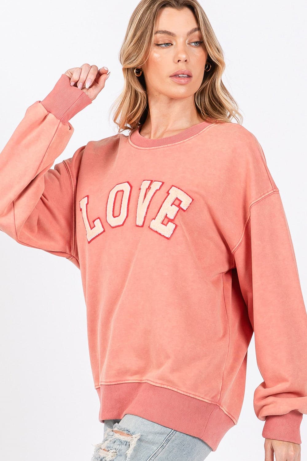 Love-inspired drop shoulder sweatshirt with playful applique details