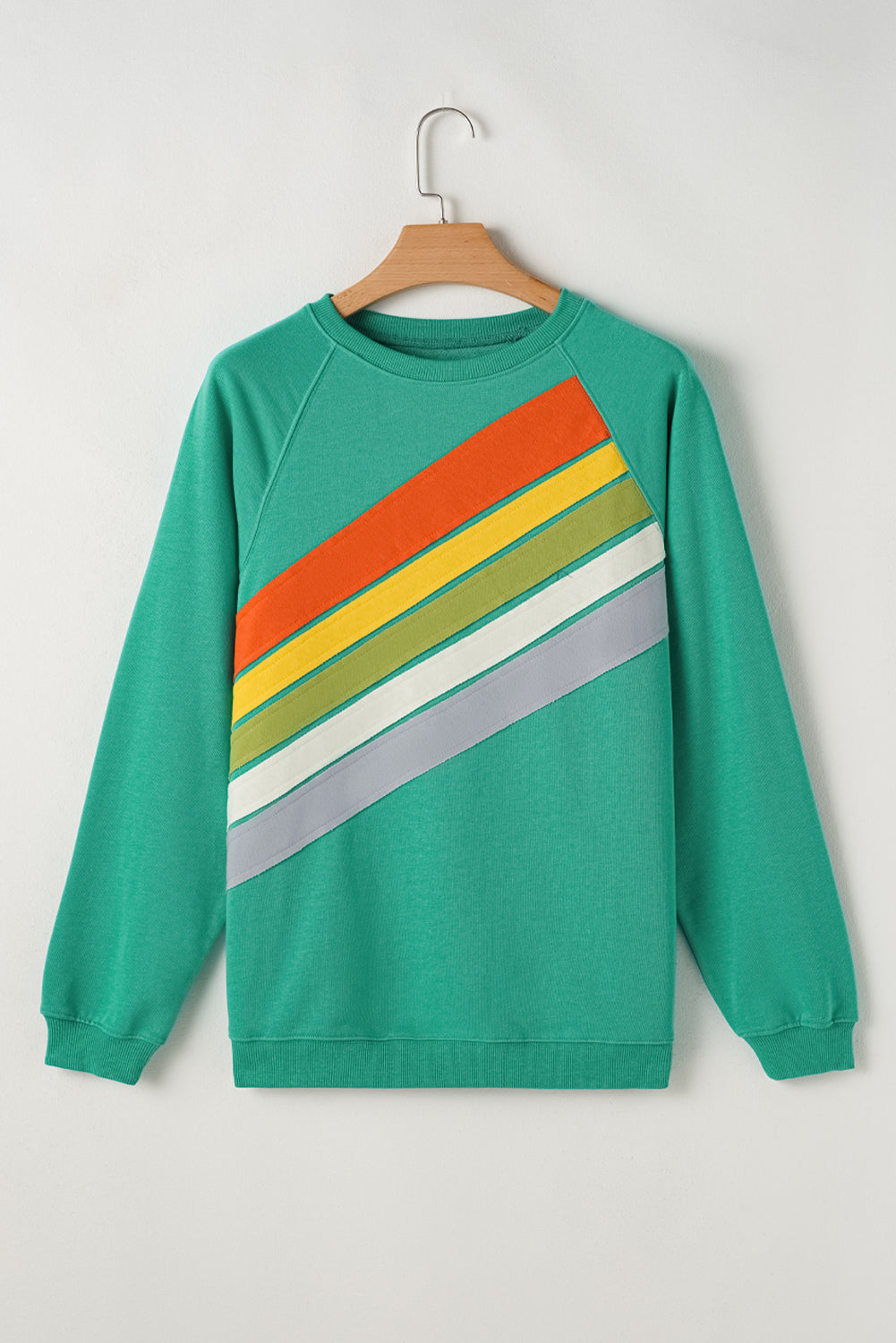 Vibrant mint green striped pullover with rainbow colorblock design