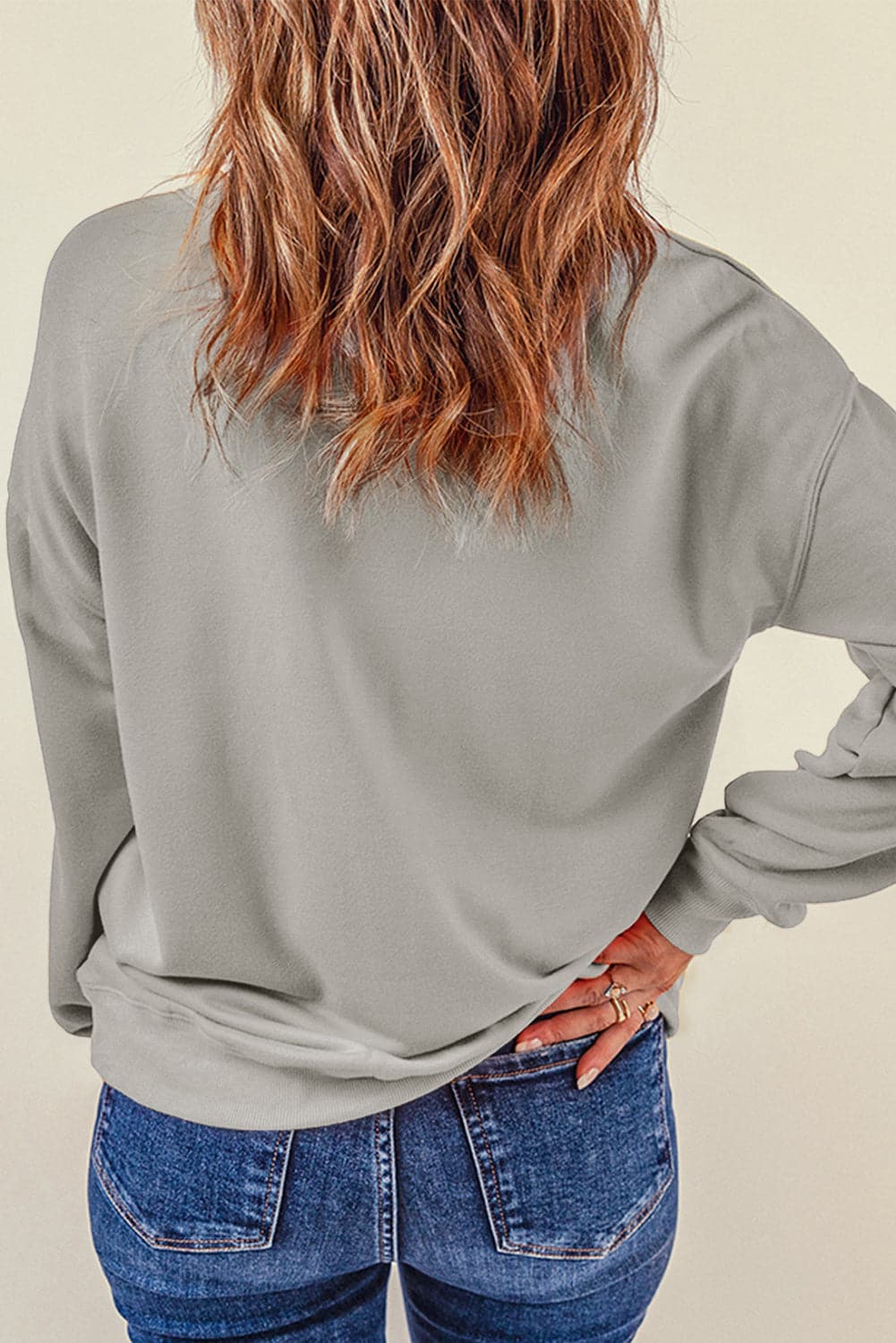 Bow Graphic Round Neck Long Sleeve Sweatshirt.