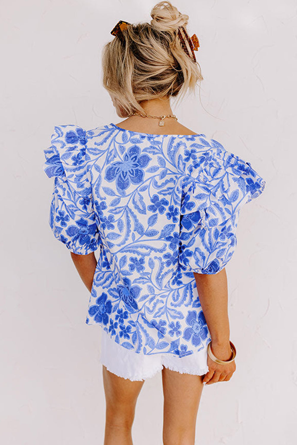 Elegant dark blue floral ruffled blouse with bubble sleeves