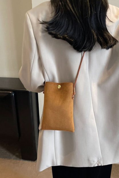 Chic mini suede crossbody bag with snap closure