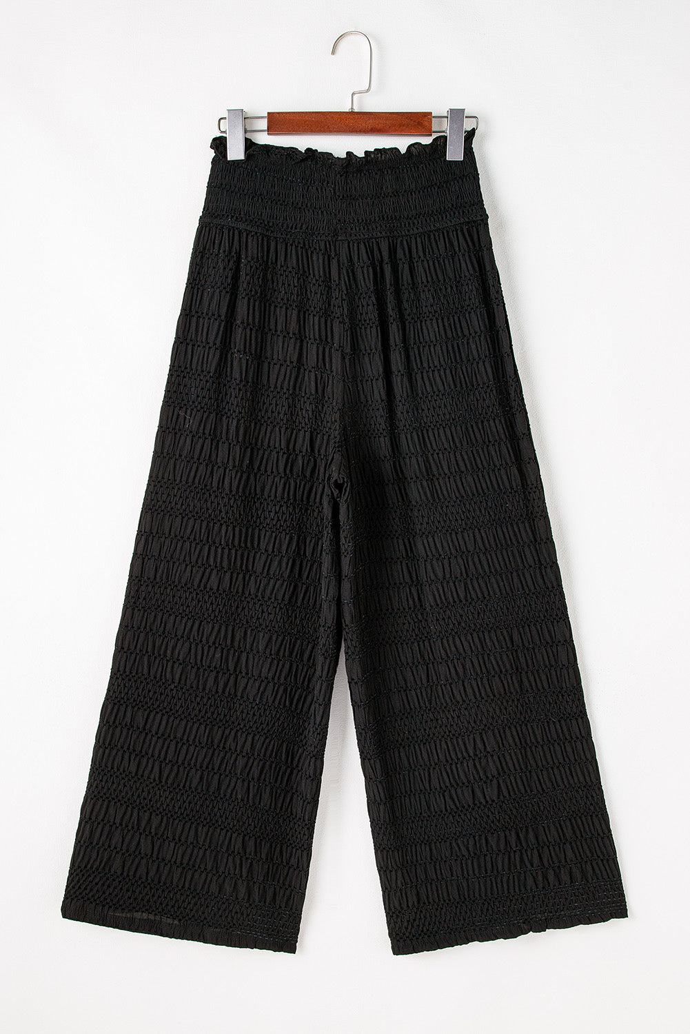 Relaxed black textured smocked waist wide-leg pants