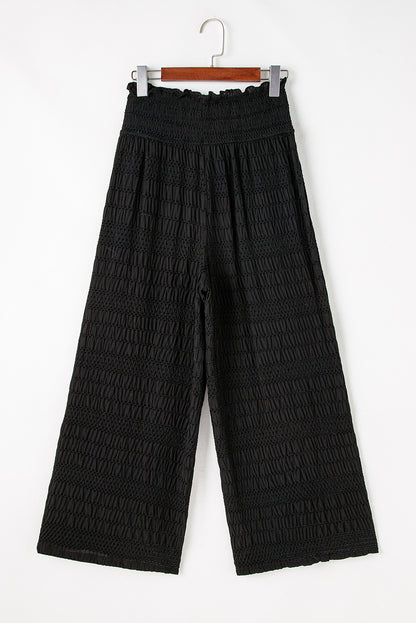 Relaxed black textured smocked waist wide-leg pants