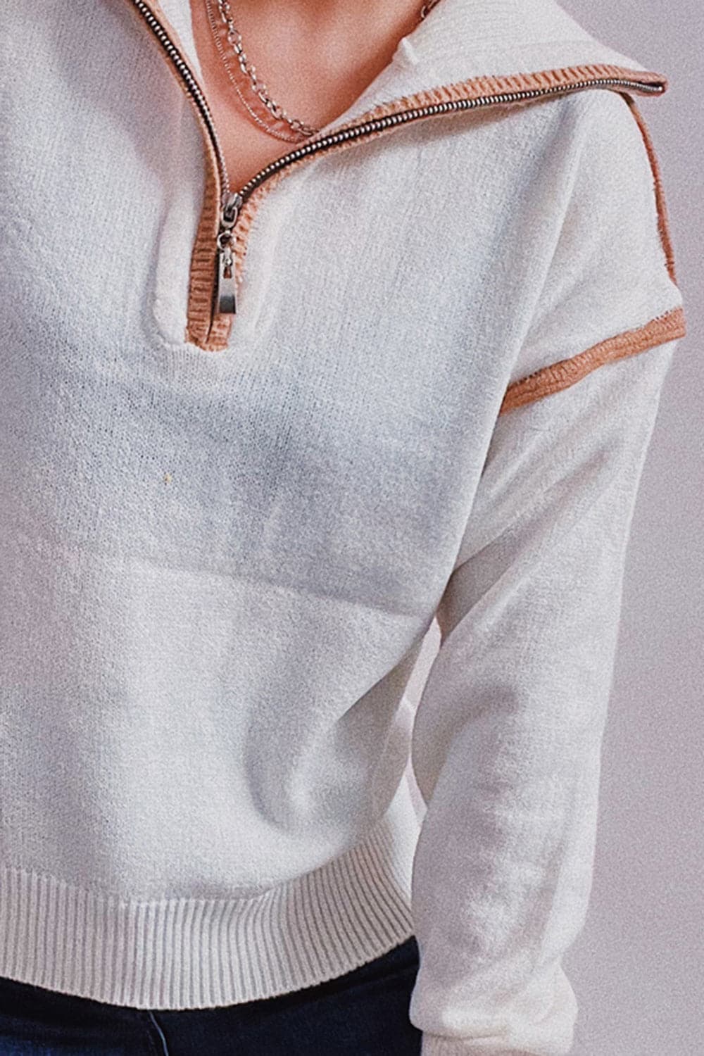 Exposed Seam Half Zip Sweater.