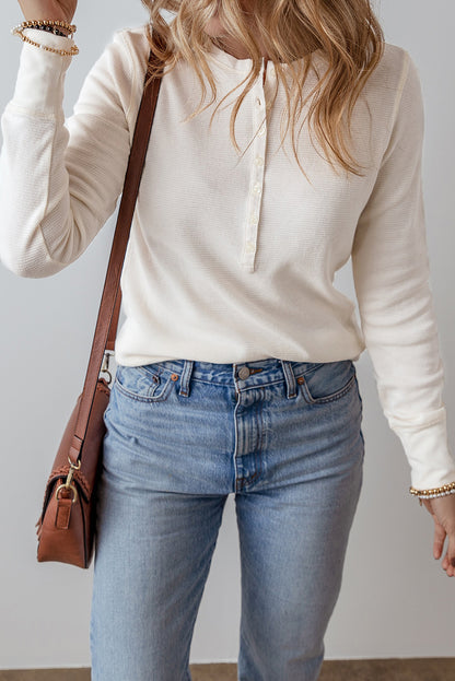 Chic white waffle knit long sleeve top with half button detail