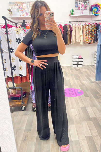 Chic black crop top and wide leg pants ensemble